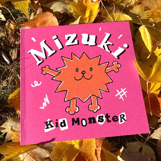 a photo of the Mizuki comic nestled in autumn leaves
